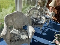 Three wicker chairs, and small, wicker table and