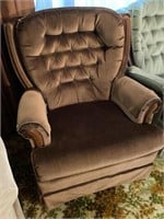 Brown swivel, rocker, upholstered chair