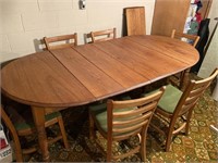 Oak table with seven leaves and six chairs