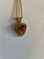 14 karat gold necklace &heart pendant that is 14k