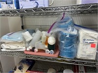 Shelf with sponge gauze plastic bottes.