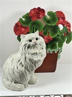 Ceramic cat and glass flower décor.