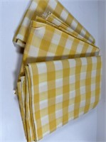 Yellow checkered tablecloths.