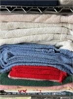 Lot of white blue red towels.