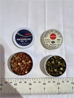 Two containers of percussion caps