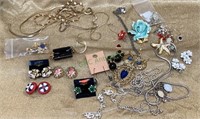 Mixed jewelry lot includes necklaces, earrings,