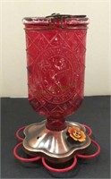 Hummingbird feeder with glass top and metal base