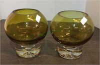 Two unique thick glass candle holders measuring