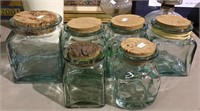 Thick glass canisters with cork tops in four