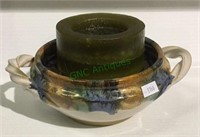 Beautiful pottery bowl with handles utilized as