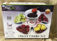 Flower fondue set includes four piece fork,