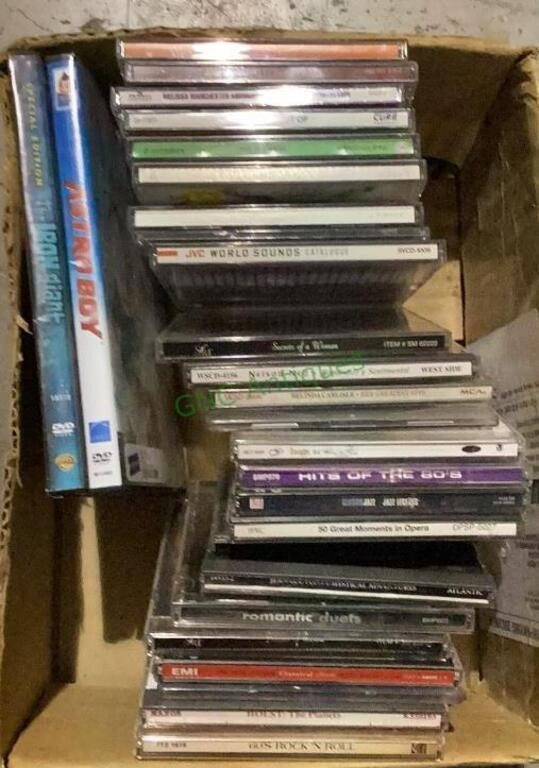 Box of entertainment includes CDs and two DVDs.