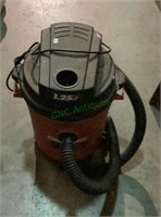 Small 1.25 hp shop vac with hose.    1712