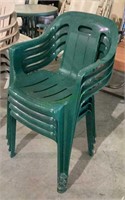 Lot of four green molded plastic patio chairs