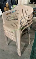 Lot of four beige plastic molded patio chairs