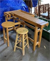 Wooden workbench with two wood clamps with