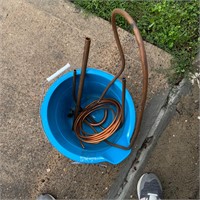 Bucket with misc pieces of brass tubing