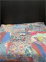 Hand tied quilt with floral design