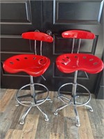 Two red barstool chairs