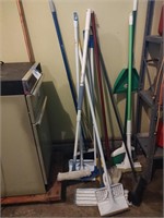 Lot of mops and brooms