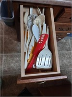 Group of plastic kitchen utensils, including