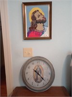 Needlepoint picture of Jesus and a clock. Picture