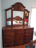 Beautiful chest of drawers with attached mirror.