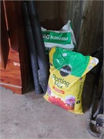 Large bags of potting soil, peat moss, rolls of