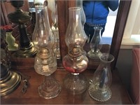 Three antique oil lamps