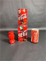 Three Coca-Cola Penny Banks