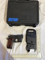 Sig Sauer P238. 380 auto with Veridian, laser