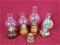 4 oil lamps and storage box