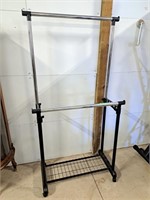 Rolling adjustable clothing rack.