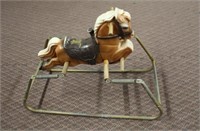 Plastic spring horse on metal base, 32 X 15 X
