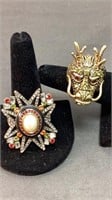 2 Heidi Daus rings, Dragon head is size 7, faux