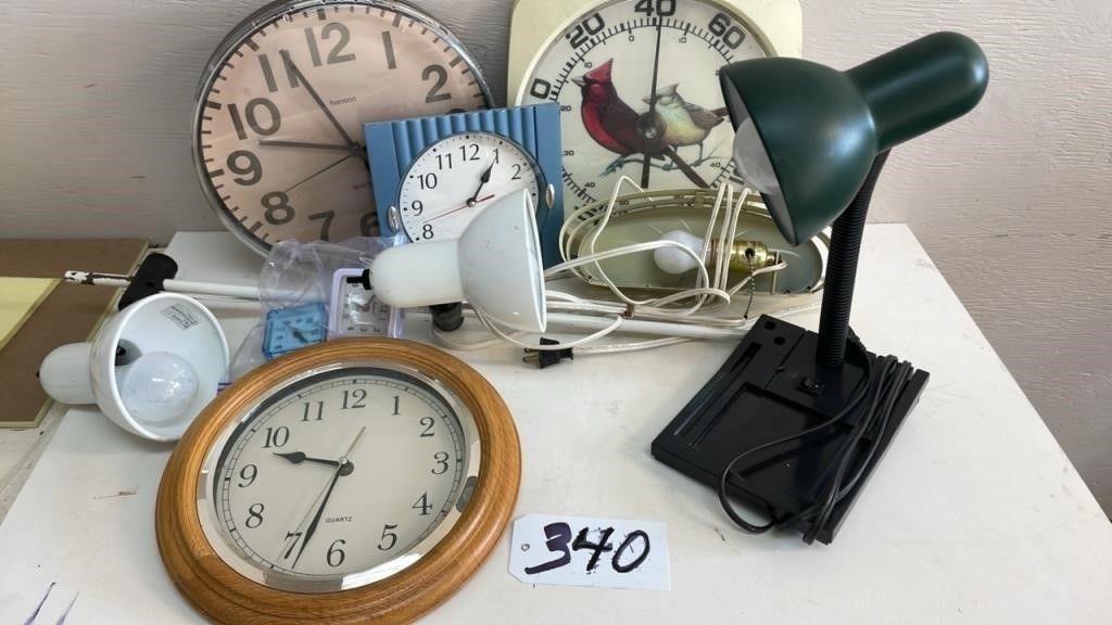 Assortment of lamps , clocks and thermometers. NO