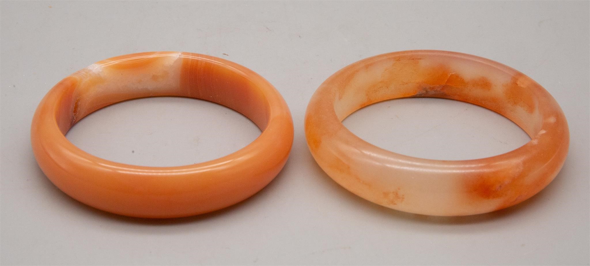 Pair Of Orange Bracelets