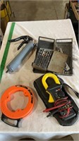 Drill bits, fish tape, grease gun