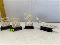 4 SMALL CARVED ASAIN RESON SCULPTURES ON STANDS