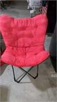 Folding cushioned chair