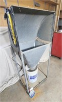 Portable dust collector on rollers.