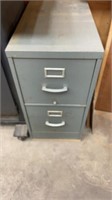 Filing cabinet 2 drawer filled w painting
