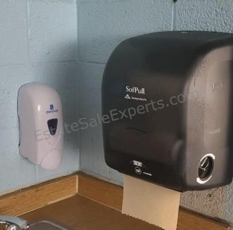 Soap and towel dispensers in room 103.