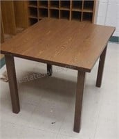 Wood table with Formica top. 26×36×30.