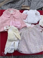 Large amount of old baby doll clothing