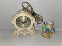 White ceramic clock and vase