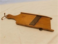 Vintage wooden adjustable vegetable slicer.