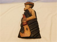 Wooden wall art handcrafted in Ghana.