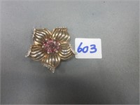 Flower brooch with pink stone