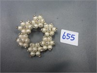 Brooch with white stones